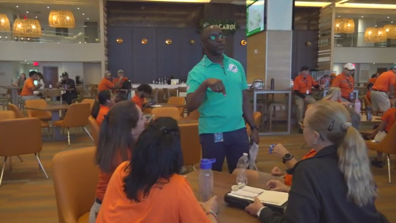 Miami Dade College professor finds his passion with side job at Hard Rock Stadium — CBS Miami, Arlington Arts news